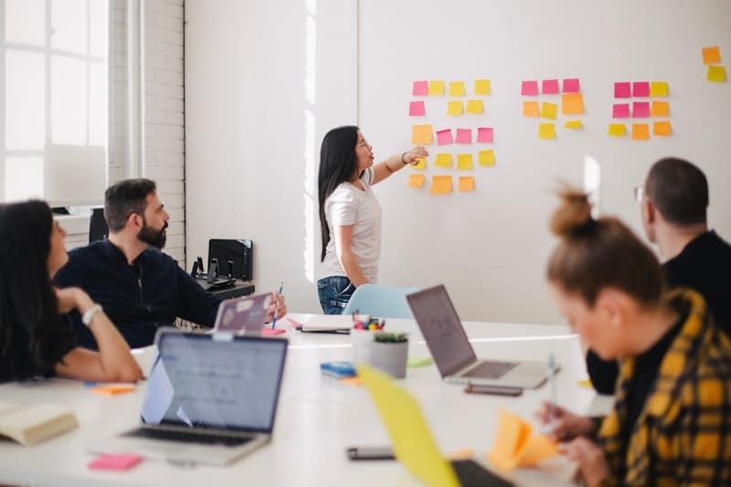 Team planning a growth strategy on a sticky-note board